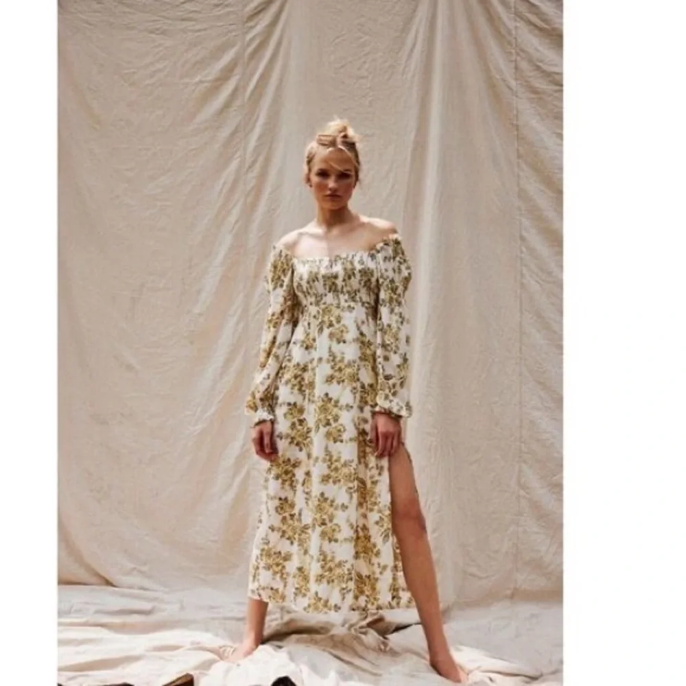 Free People Jaymes Floral Midi Dress in Pastry Cream with balloon sleeves